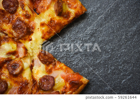 Pizza slice on the dark plate / delicious tasty Pizza slice on the dark plate / delicious tasty 59261644
