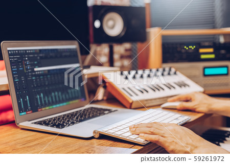 male composer, producer, arranger, song writer, musician hands arranging music on computer in home studio. music production concept 59261972
