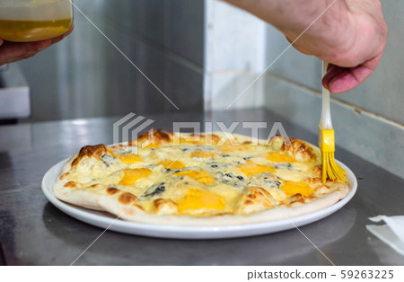 chef making pizza in the pizzeria chef making pizza in the pizzeria 59263225