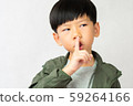 An adorable little boy touch his forefinger to his lip and do the shh.. expression. Keep quoted, Mute, Secret, Silent, Child development, No sound Concept 59264166