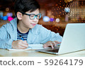 A young smart asian boy using laptop computer to study e-learning, coding program, access online education, search engine. New media, Education system tools, Social media, Digital Technology concept. 59264179