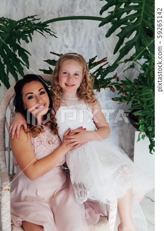 Portrait of a beautiful fashionable mom and daughter's family love Portrait of a beautiful fashionable mom and daughter's family love 59265142