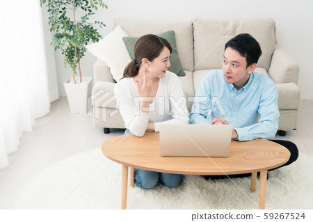 Young man and woman doing research with a laptop Young man and woman doing research with a laptop 59267524