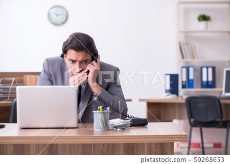 Young male employee in industrial espionage concept 59268653