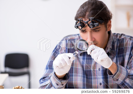 Young male jeweler at workshop 59269876