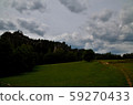 Dark clouds are pulling over the ground 59270433