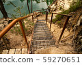 stairs leading down the glass path to the rock lake 59270651