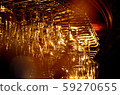 glasses on the bar in yellow light 59270655