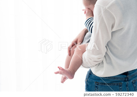 Mother holding a baby Mother holding a baby 59272340