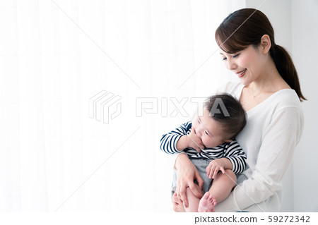 Mother holding a baby Mother holding a baby 59272342