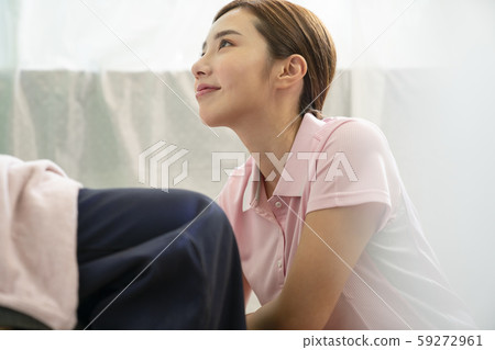 Female caregiver wheelchair 59272961