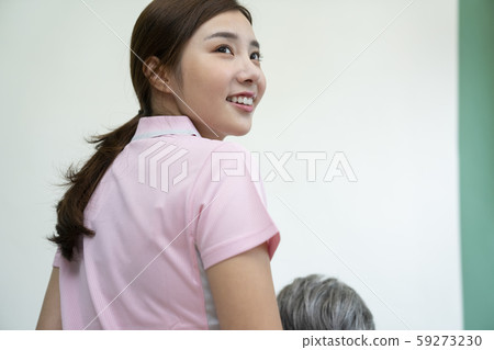 Female caregiver hospital 59273230