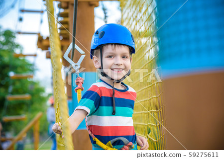 Young boy playing and having fun doing activities Young boy playing and having fun doing activities 59275611