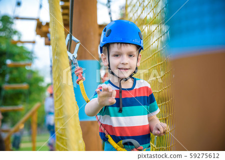 Young boy playing and having fun doing activities Young boy playing and having fun doing activities 59275612