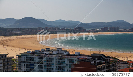Beach in the middle of the city crowded with houses 59275777