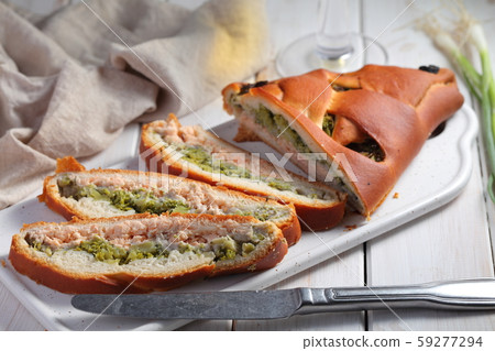 Salmon and broccoli pie on a rustic table Salmon and broccoli pie on a rustic table 59277294