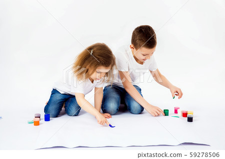 Two pretty child friends boy and girl are drawing pictures by paints 59278506