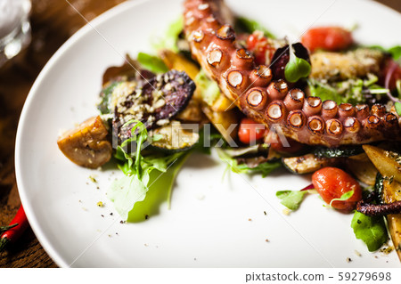 Octopus salad served on a plate in restaurant Octopus salad served on a plate in restaurant 59279698