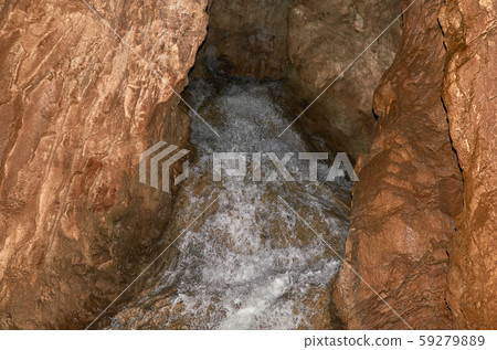 Stream in a cave Stream in a cave 59279889