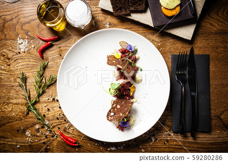 Steak tartare served on a plate in restaurant 59280286
