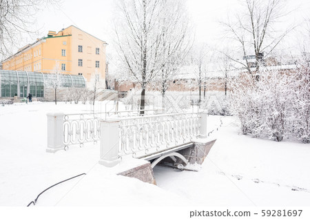Pedestrian bridge in snowy park in winter 59281697