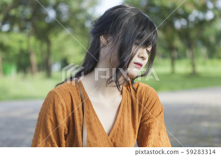 Asian young woman in the park 59283314