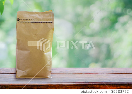Paper packaging smelling hole, Coffee bean packaging smell the flavor of coffee wafting on wooden 59283752