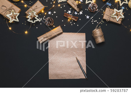 Happy New year 2020. Writing Goals on Kraft paper decorated with Christmas Gold and silver Happy New year 2020. Writing Goals on Kraft paper decorated with Christmas Gold and silver 59283787