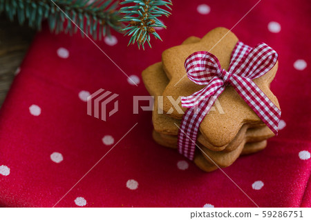 A pile of gingerbread Christmas cookies on red A pile of gingerbread Christmas cookies on red 59286751