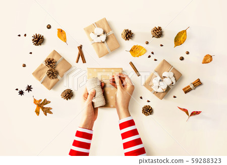 Person making present boxes 59288323