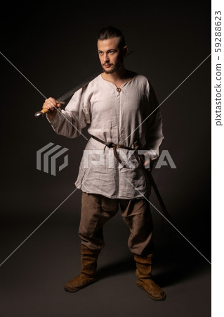 Young brunet in viking image view in the dark Young brunet in viking image view in the dark 59288623