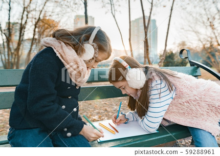 Two little pretty artists drawing with colored pencils 59288961