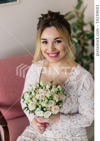 Beautiful woman in wedding dress in photo studio. Beautiful woman in wedding dress in photo studio. 59289683