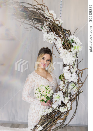 Beautiful woman in wedding dress in photo studio. Beautiful woman in wedding dress in photo studio. 59289882