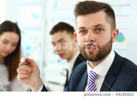 Concentrated man in office 59289883