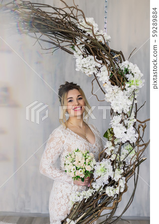 Beautiful woman in wedding dress in photo studio. Beautiful woman in wedding dress in photo studio. 59289884