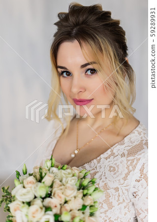 Beautiful woman in wedding dress in photo studio. Beautiful woman in wedding dress in photo studio. 59289931