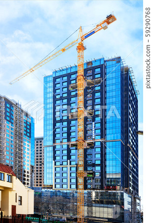 The glass facade, a reflection of the blue sky 59290768