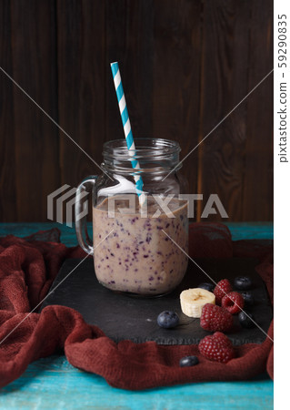 Photo of jar with smoothie on table Photo of jar with smoothie on table 59290835