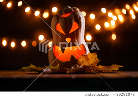Photo of halloween pumpkin cut in shape of face 59291078