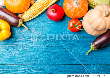 Photo of blue wooden table with autumn vegetable 59291148