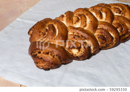 Fresh ruddy freshly cooked pie lies on the towel 59295330