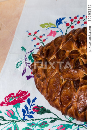 Fresh ruddy freshly cooked pie lies on the towel Fresh ruddy freshly cooked pie lies on the towel 59295372