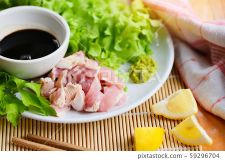 Sashimi raw chicken on white plate with wasabi Sashimi raw chicken on white plate with wasabi 59296704