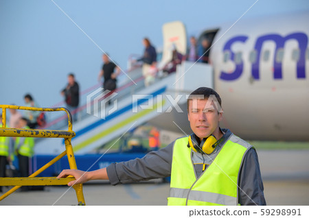 airport worker arrival landing runway outside male 59298991
