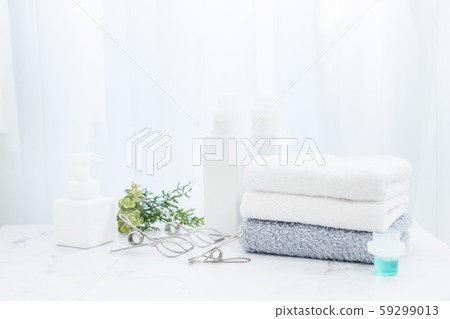 A towel washed in detergent and folded in the room. Image of housework. 59299013