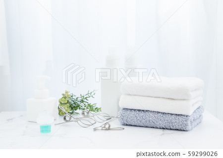 A towel washed in detergent and folded in the room. Image of housework. A towel washed in detergent and folded in the room. Image of housework. 59299026