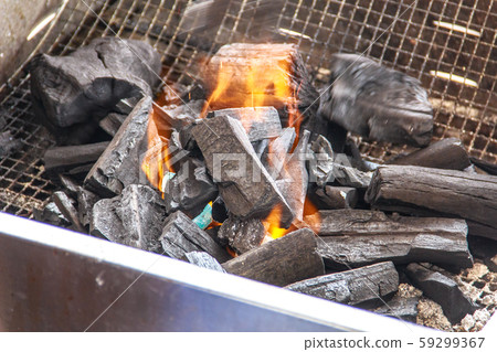 Charcoal and ash burning in the grill 59299367
