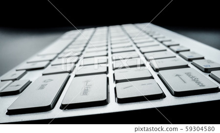 Close-up soft-focus laptop computer keyboard. 59304580