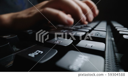 Close-up soft-focus finger typing on keyboard. Close-up soft-focus finger typing on keyboard. 59304588